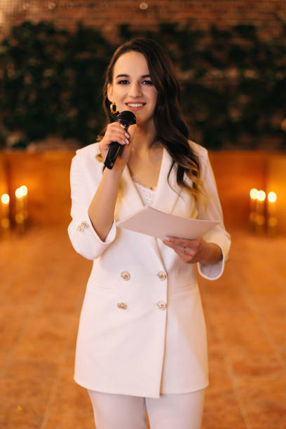 istock Master of ceremonies with microphone. wedding ceremony. hall 2201462197