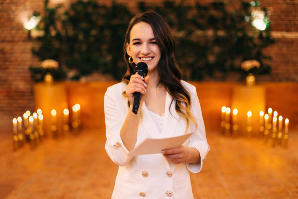 istock fun master of ceremonies with microphone in hall 2201462202