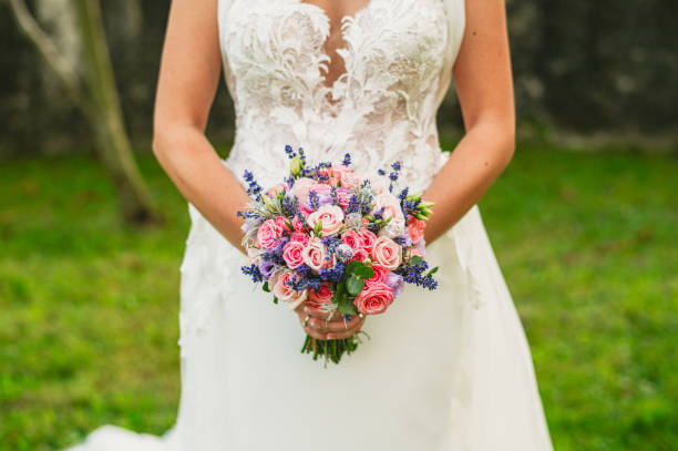 Wedding bouquet in hands of the bride
