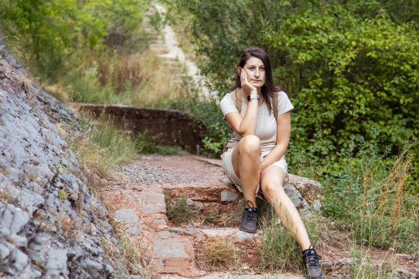 istock Connecting with nature. Woman backpacker exploring forest.  Precious moments while enjoying her adventure in parkland. 2201471314