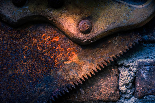 A close-up view of the rusty teeth of a hand saw for wood