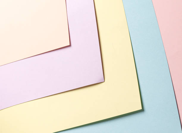 istock Pastel abstract geometric paper background featuring peach, lavender, yellow, blue, and pink hues in 2201475228