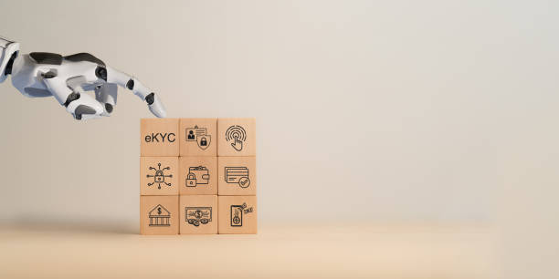 istock AI and eKYC digital identity verification technology concept. Robotic hand interacting with wooden blocks featuring eKYC (electronic Know Your Customer) icon. Secure digital transactions and banking. 2201479629