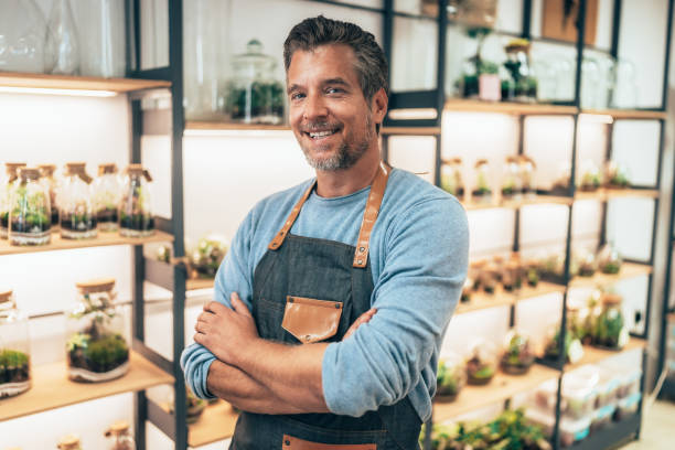 istock Cheerful flower shop owner 2201479701