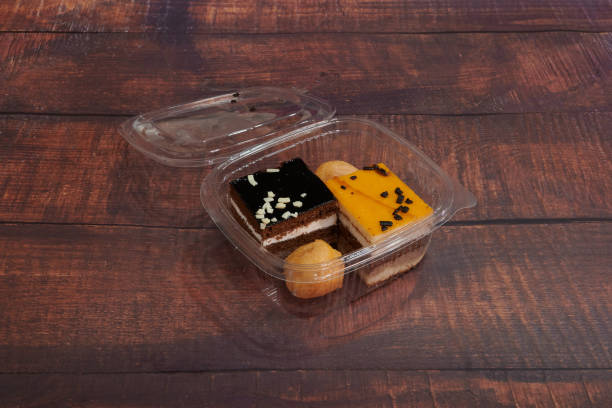 istock A box of assorted desserts sits on a wooden table 2201480072