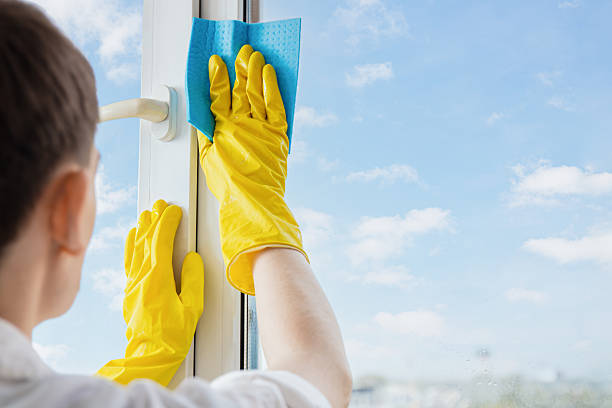 istock Man In Rubber Gloves Cleaning Windows In Spring 2201483195