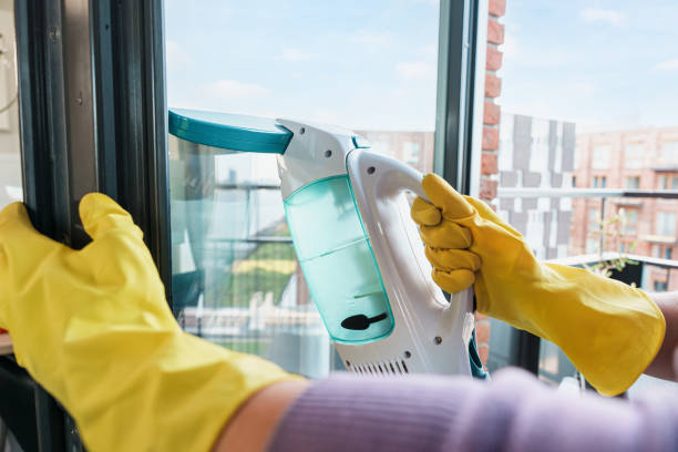 istock Cleaning Windows With A Cordless Window Vacuum Cleaner 2201483205