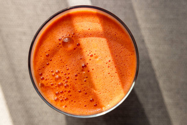 view of a glass filled with freshly squeezed fruit juice