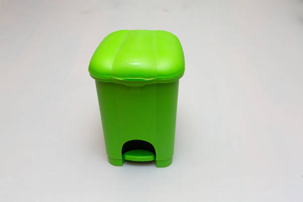 istock Green pedal trash can standing on white background 2201484413