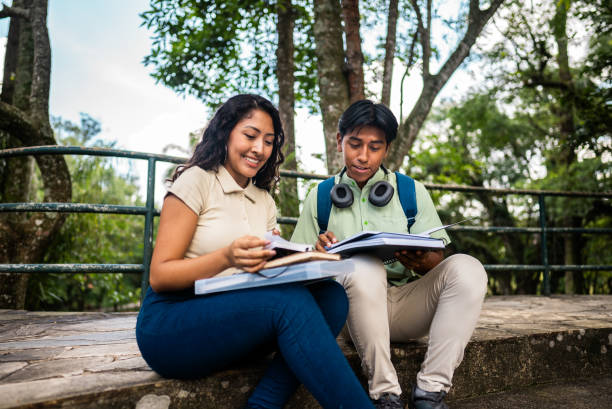 istock Friends studying in a public park 2201484993