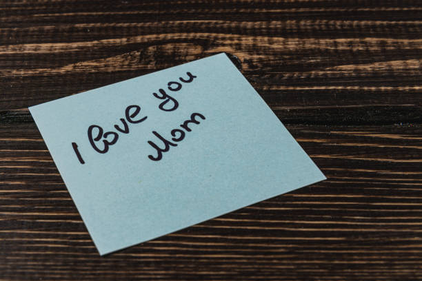 istock Love and gratitude to mom on a blue sticky note 2201486191