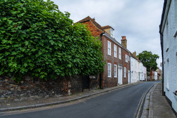 Guildford, Surrey, UK - September 24, 2014: Guildford cobbled High Street and almshouses