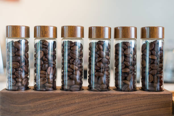 istock Coffee beans in a shot glass for test 2201488993