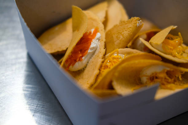 istock Khanom Buang or Thai crispy pancake in paper box 2201489025