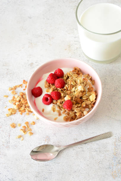 istock Yogurt with Granola and Raspberries vertical photo 2201502832