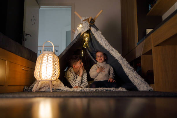 istock Sibling Bonding in a Cozy Blanket Fort 2201508443