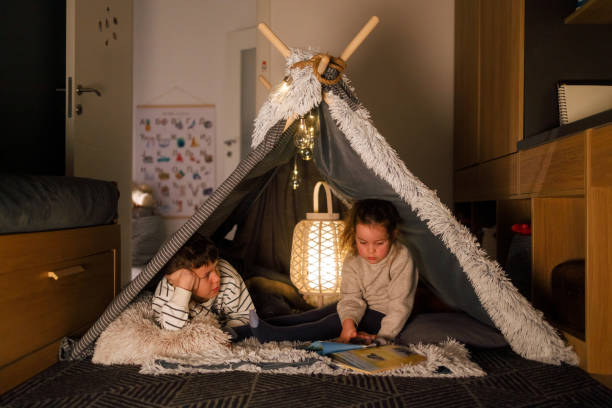 istock Sibling Bonding Time in a Cozy Blanket Fort 2201508448