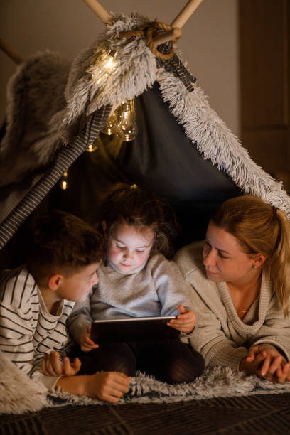 istock Family Bonding with a Digital Tablet in a Cozy Blanket Fort 2201508453