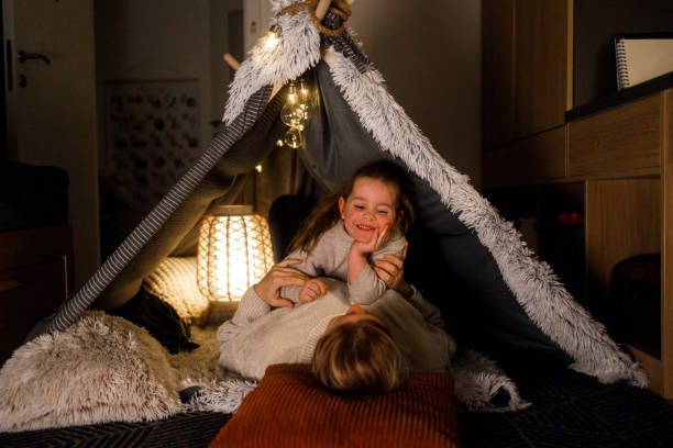 istock Mother and Daughter Bonding in a Cozy Blanket Fort 2201508461