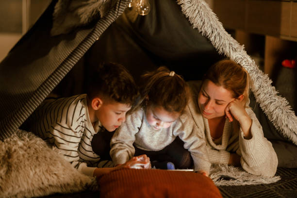 istock Family Bonding with a Digital Tablet in a Cozy Blanket Fort 2201508463