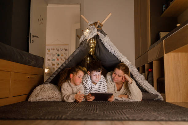 istock Family Bonding with a Digital Tablet in a Cozy Blanket Fort 2201508464