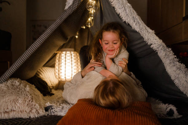 istock Mother and Daughter Bonding in a Cozy Blanket Fort 2201508478
