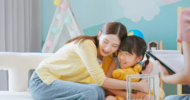 istock asian mother hugs daughter counseling 2201508832