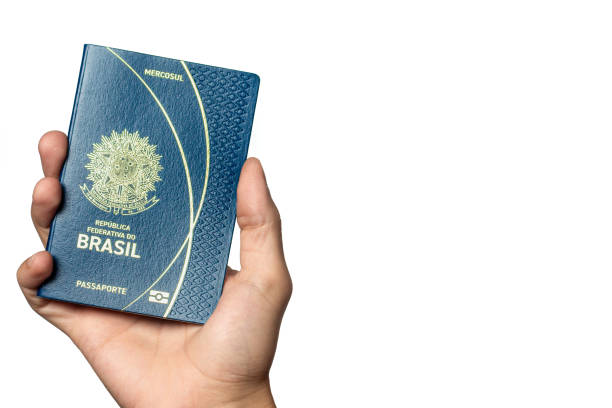 istock Person holding a Brazilian Passport on white background with copy space. 2201512166