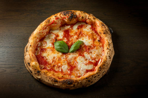 istock Margherita pizza, traditional with mozzarella tomato and basil leaf 2201514483