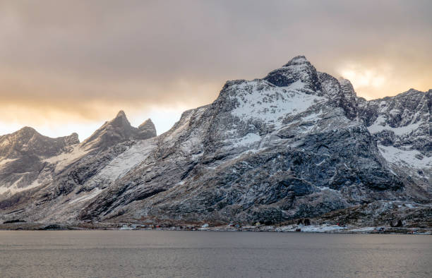 istock Golden Arctic Light Over Snow-Capped Mountains in Lofoten, Norway 2201517200