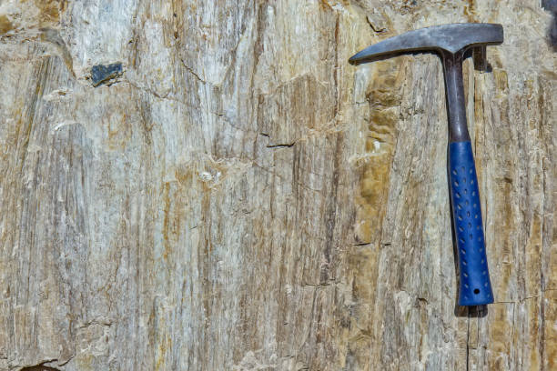 istock Geology Hammer on metamorphic rocks 2201517291