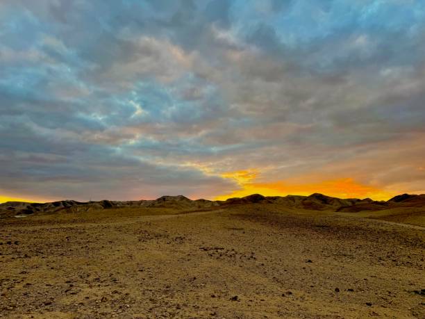 istock Dramatic Desert Landscapes with Rugged Canyons and Sunset Skies 2201517796