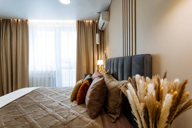 istock Discover a Cozy Modern Bedroom designed with Plush Bedding and Elegant Decor that creates an inviting and relaxing atmosphere for all 2201519192