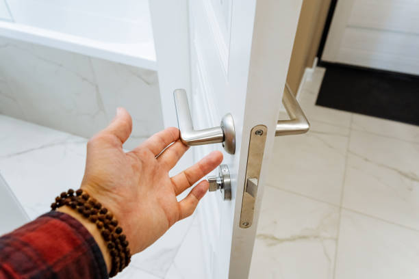 istock A person is actively opening a wooden door using their hand 2201519195
