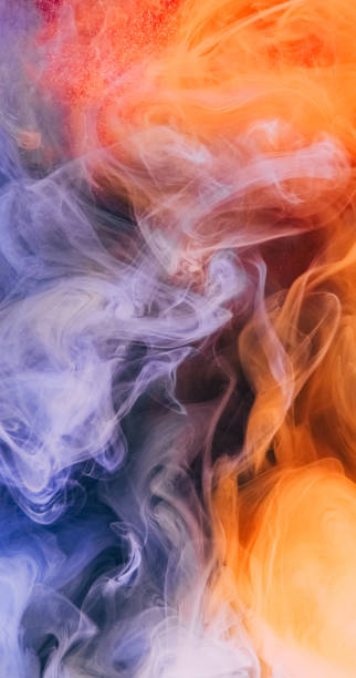 istock Ink water shot color smoke orange blue vapor flow 2201521482