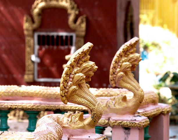 Shot in color detail on the facade of this historic building representing some character, animal or flower. Set at Siem Riep, Angkor Wat , Cambodia, Asia