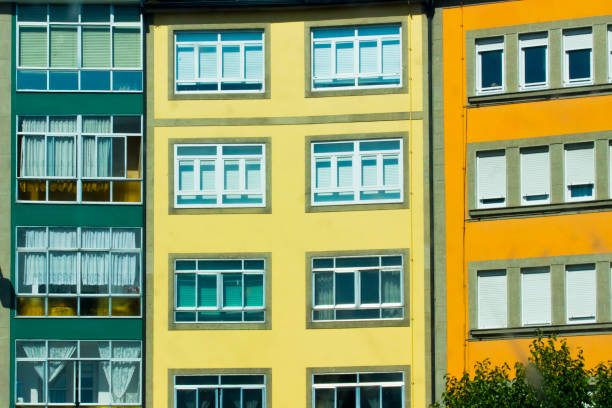 Row of restored multi colored apartment buildings in Lugo city, Galicia, Spain.