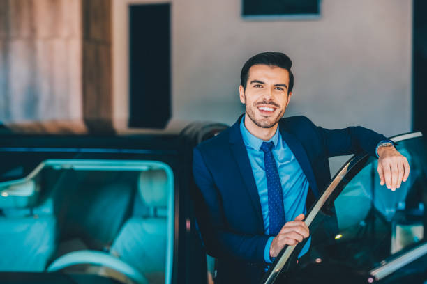 istock Businessman enjoying new car 2201526834