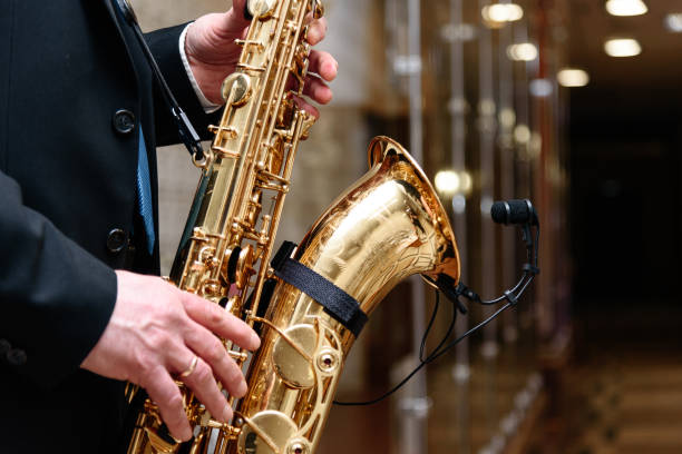istock musician in suit plays saxophone 2201529788