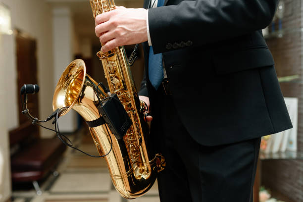 istock musician in suit plays saxophone 2201529798