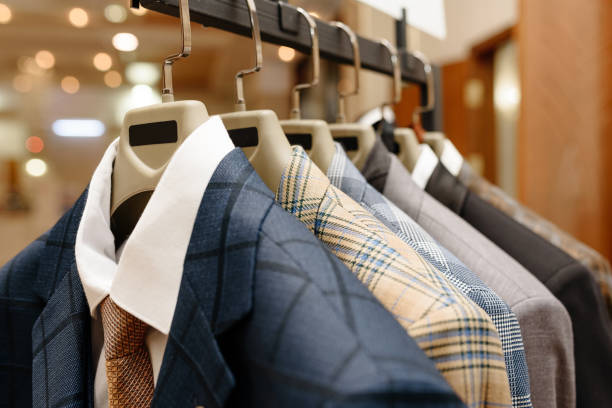 istock men jackets hang on hangers in showroom 2201529804