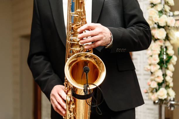 istock musician in suit plays saxophone 2201529805