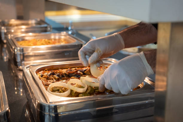 istock Restaurant service staff complete the meals at the hotel buffet. 2201531341