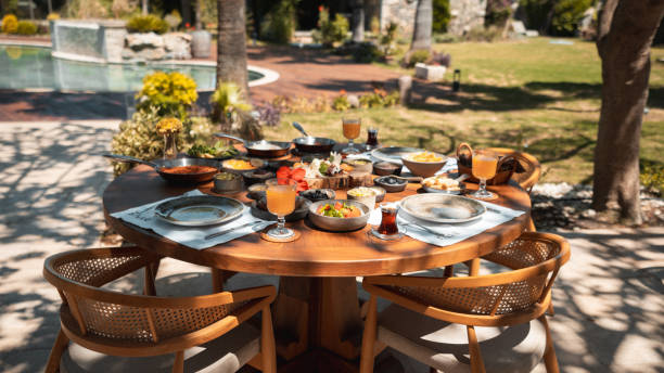 istock Hearty Breakfast on Wooden Table Outdoors 2201539317