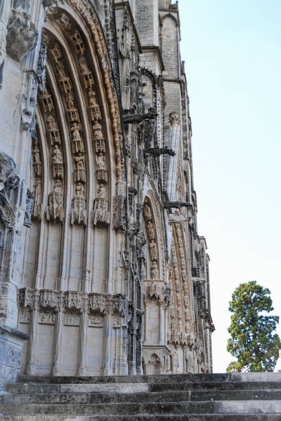 A stone staircase leading to the portico of the main entrance of the Cathedral of Bourges (France). In it you can see beautiful details and carved figures.