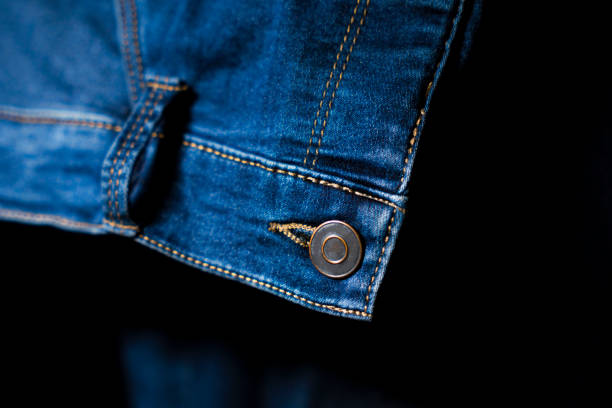 istock Close-Up of Button and stitching on Blue Jeans, Detailed Denim Design 2201541608