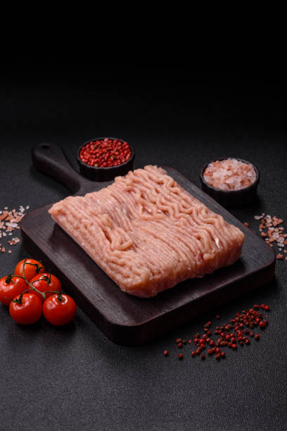 istock Raw minced chicken with salt, spices and herbs 2201544416