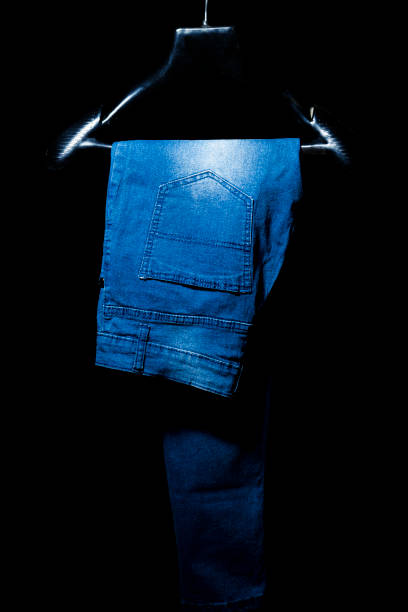 Blue Jeans on Hanger, Isolated on Black Background