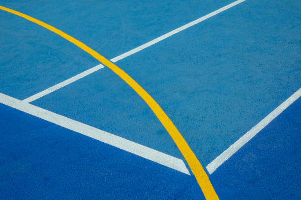 istock Sport field court background. Blue rubberized and granulated ground surface with white, yellow lines on ground. Top view 2201545376