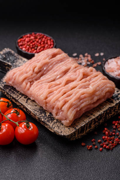 istock Raw minced chicken with salt, spices and herbs 2201545388